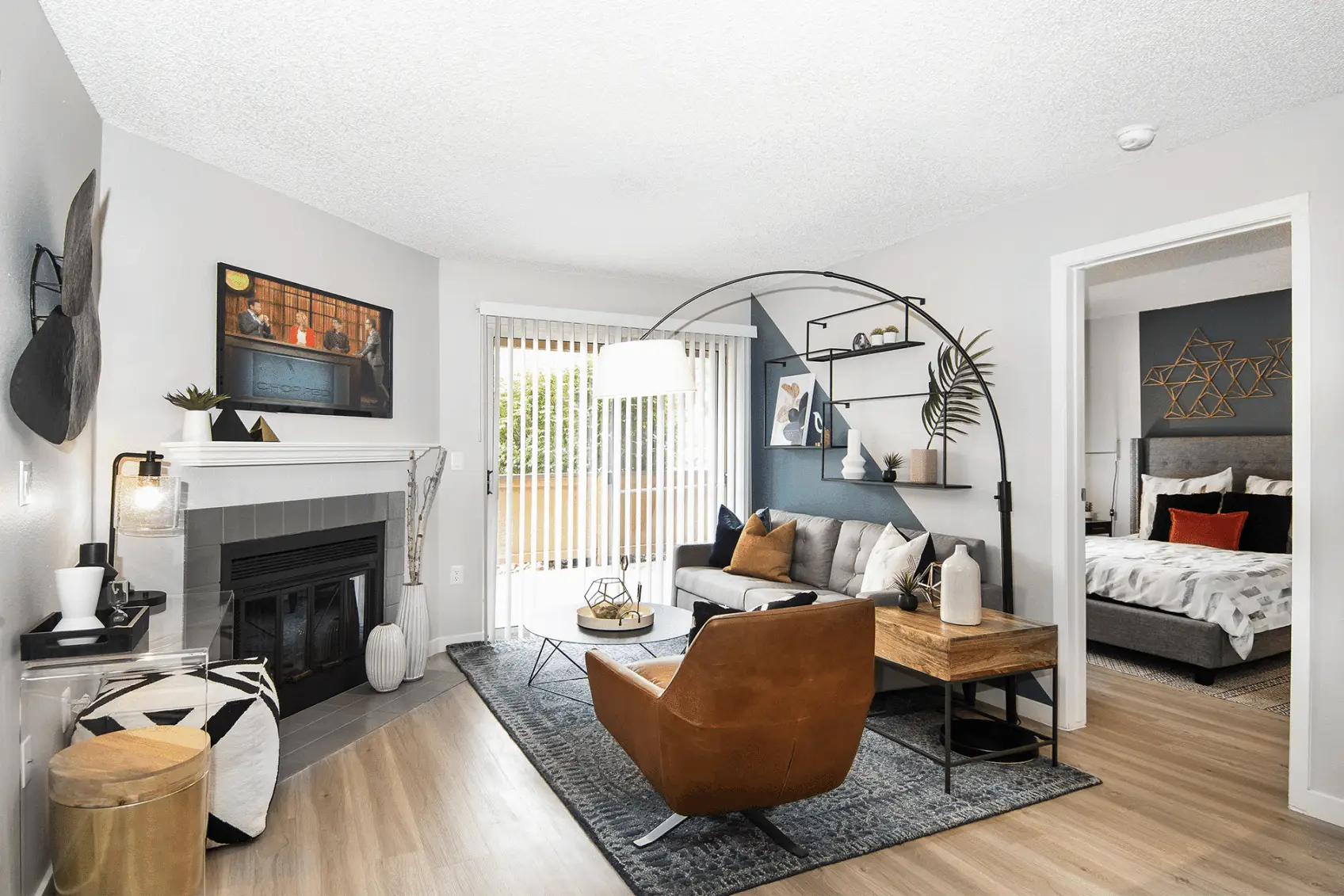 Open living space with fireplace and glass patio doors