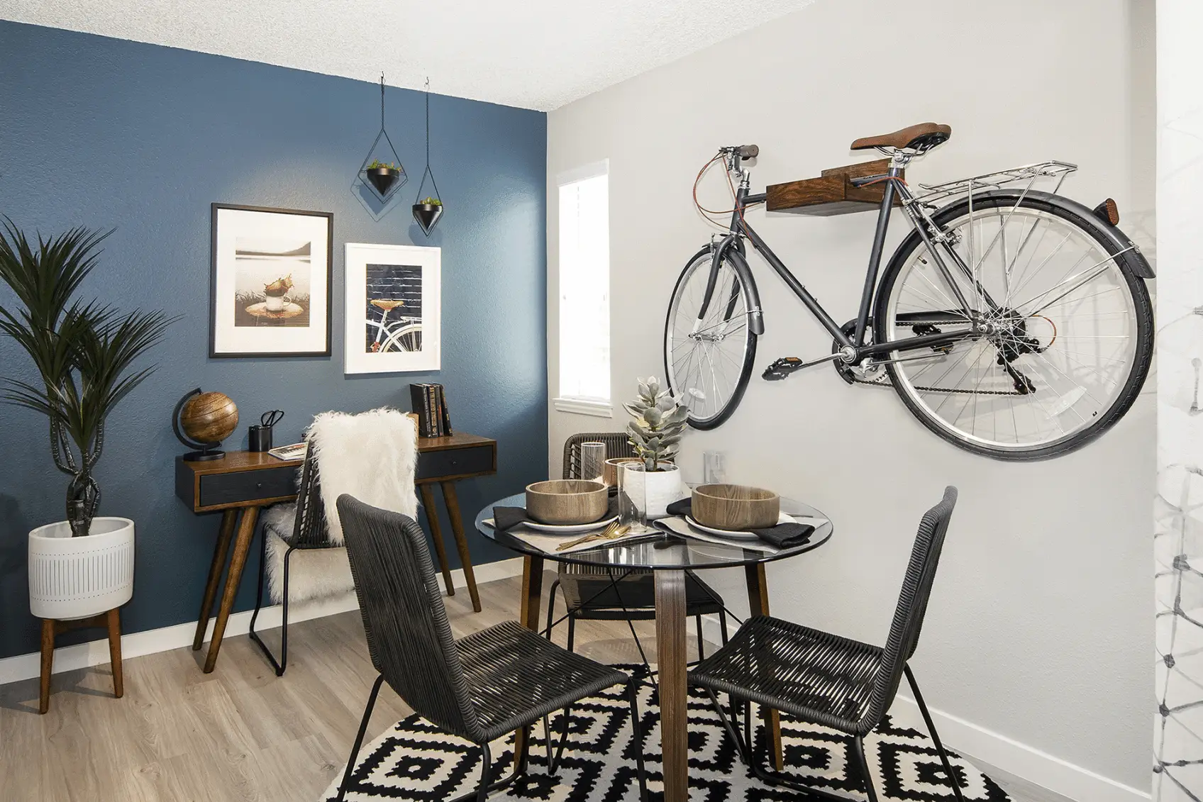 Dining nook with blue accent wall, small window