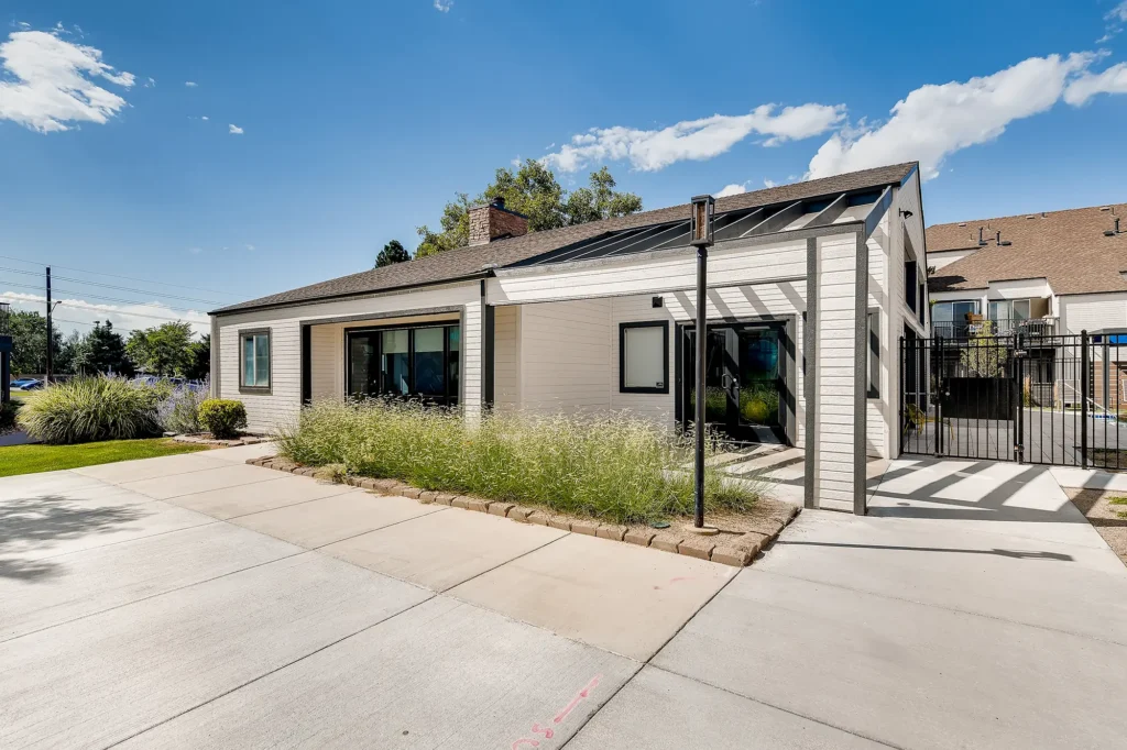 Leasing office exterior with adjacent pool deck
