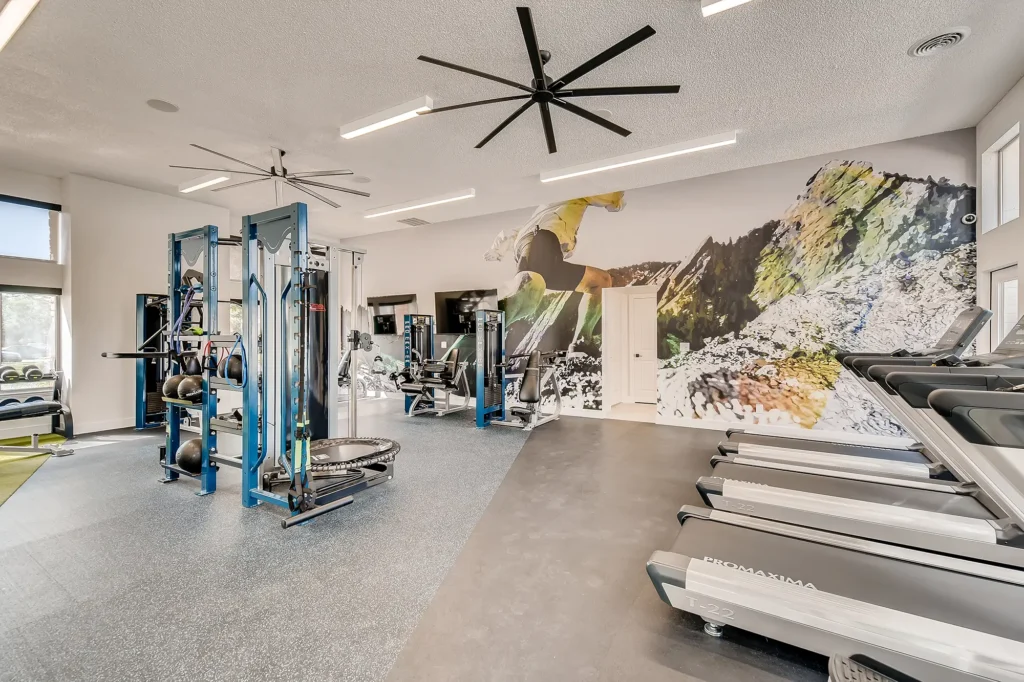 fitness center with treadmills and strength training machines