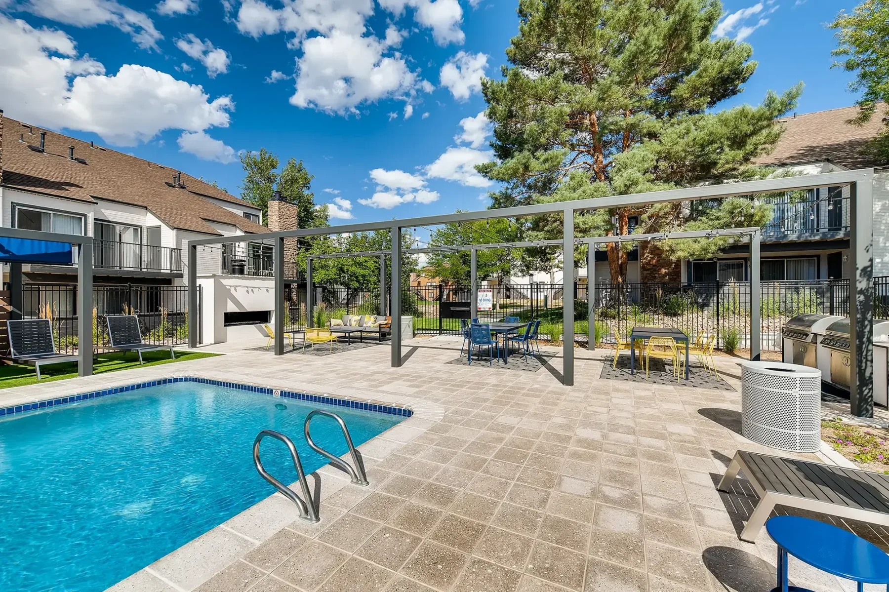 Pool with deck seating and grilling area