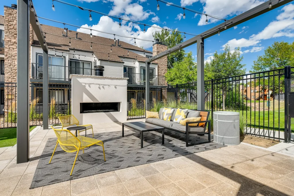 Outdoor fireplace with sofas and chairs